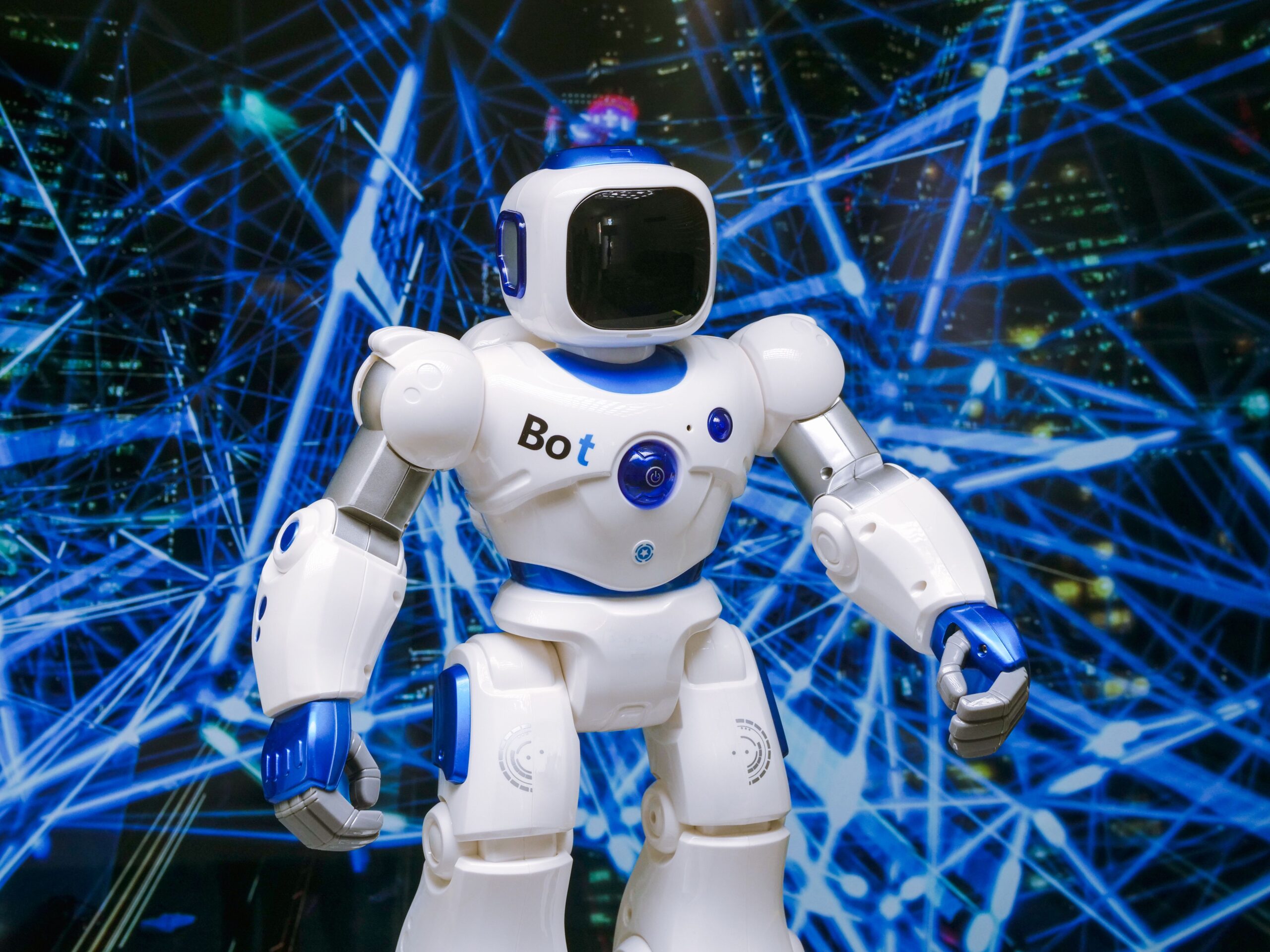 Projects Advanced humanoid robot with glowing blue accents in a digital network setting.